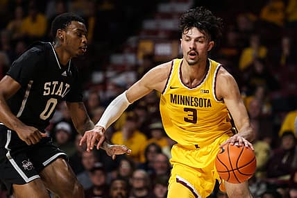 Dec 11, 2022; Minneapolis, Minnesota, USA; Minnesota Golden Gophers forward Dawson Garcia (3) dribbles the ball while Mississippi State Bulldogs forward D.J. Jeffries (0) defends during the first half at Williams Arena. Mandatory Credit: Matt Krohn-USA TODAY Sports