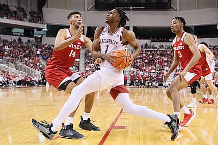 Dec 17, 2022; North Little Rock, Arkansas, USA; Arkansas Razorbacks guard Ricky Council IV (1) drives to the basket as Bradley Braves forward Malevy Leons (14) and guard Zek Montgomery (3) defend in the second half at Simmons Bank Arena. Arkansas won 76-57. Mandatory Credit: Nelson Chenault-USA TODAY Sports