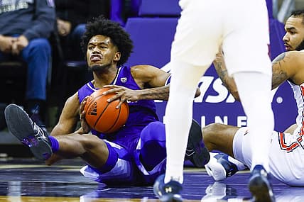 Dec 21, 2022; Seattle, Washington, USA; Washington Huskies forward Keion Brooks (1) attempts to pass after collecting a loose ball against Auburn Tigers forward Johni Broome (4) during the second half at Alaska Airlines Arena at Hec Edmundson Pavilion. Mandatory Credit: Joe Nicholson-USA TODAY Sports