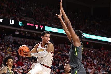 Dec 31, 2022; Ames, Iowa, USA; Baylor Bears forward Flo Thamba (0) defends Iowa State Cyclones guard Tamin Lipsey (3) at James H. Hilton Coliseum. Mandatory Credit: Reese Strickland-USA TODAY Sports