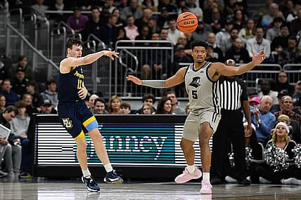 Dec 20, 2022; Providence, Rhode Island, USA; Marquette Golden Eagles guard Tyler Kolek (11) passes the ball during the first half against the Providence Friars at Amica Mutual Pavilion. Mandatory Credit: Eric Canha-USA TODAY Sports