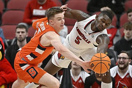 Jan 3, 2023; Louisville, Kentucky, USA; Syracuse Orange guard Justin Taylor (5) scrambles for a loose ball with Louisville Cardinals forward Brandon Huntley-Hatfield (5) during the first half at KFC Yum! Center. Mandatory Credit: Jamie Rhodes-USA TODAY Sports