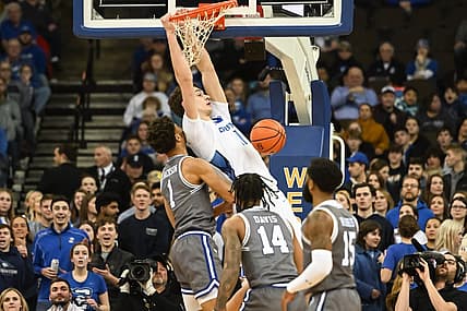 Jan 3, 2023; Omaha, Nebraska, USA; Creighton Bluejays center Ryan Kalkbrenner (11) dunks over Seton Hall Pirates forward Tray Jackson (1) in the first half at CHI Health Center Omaha. Mandatory Credit: Steven Branscombe-USA TODAY Sports