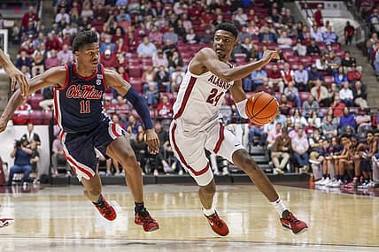 Jan 3, 2023; Tuscaloosa, Alabama, USA; Alabama Crimson Tide forward Brandon Miller (24) drives to the basket against Mississippi Rebels guard Matthew Murrell (11) during the second half at Coleman Coliseum. Mandatory Credit: Marvin Gentry-USA TODAY Sports