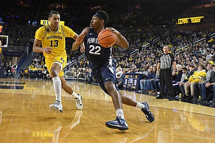 Jan 4, 2023; Ann Arbor, Michigan, USA;  Penn State's Jalen Pickett (22) drive past Michigan's Jett Howard (13) in the first half at Crisler Center. Mandatory Credit: Lon Horwedel-USA TODAY Sports