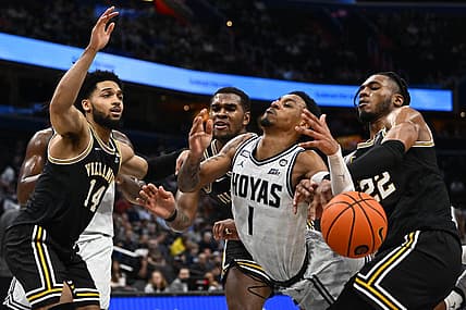 Jan 4, 2023; Washington, District of Columbia, USA; Georgetown Hoyas guard Primo Spears (1) is fouled by Villanova Wildcats forward Cam Whitmore (22) during the second half at Capital One Arena. Mandatory Credit: Brad Mills-USA TODAY Sports