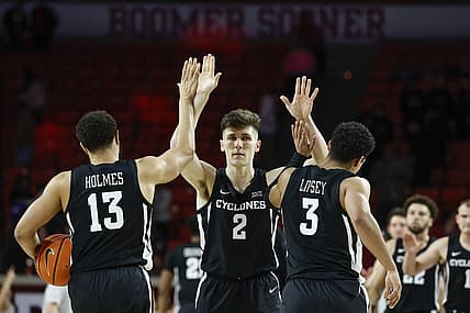 Jan 4, 2023; Norman, Oklahoma, USA; Iowa State Cyclones guard Caleb Grill (2) celebrates with guards Jaren Holmes (13) and Tamin Lipsey (3) after defeating the Oklahoma Sooners at Lloyd Noble Center. Mandatory Credit: Alonzo Adams-USA TODAY Sports