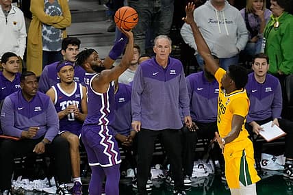 Jan 4, 2023; Waco, Texas, USA;  TCU Horned Frogs guard Mike Miles Jr. (1) makes a three point basket against Baylor Bears forward Josh Ojianwuna (15) during the second half at Ferrell Center. Mandatory Credit: Chris Jones-USA TODAY Sports