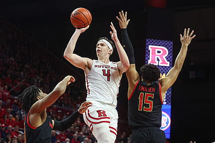 Jan 5, 2023; Piscataway, New Jersey, USA; Rutgers Scarlet Knights guard Paul Mulcahy (4) shoots the ball as Maryland Terrapins guard Ian Martinez (23) and forward Patrick Emilien (15) defends during the second half at Jersey Mike's Arena. Mandatory Credit: Vincent Carchietta-USA TODAY Sports