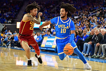 Jan 5, 2023; Los Angeles, California, USA; UCLA Bruins guard Tyger Campbell (10) moves the ball against Southern California Trojans guard Tre White (22) during the first half at Pauley Pavilion. Mandatory Credit: Gary A. Vasquez-USA TODAY Sports