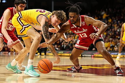 Jan 7, 2023; Minneapolis, Minnesota, USA; Minnesota Golden Gophers center Treyton Thompson (42) and Nebraska Cornhuskers forward Derrick Walker (13) dive for the ball during the first half at Williams Arena. Mandatory Credit: Matt Krohn-USA TODAY Sports