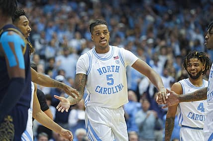 Jan 7, 2023; Chapel Hill, North Carolina, USA;  North Carolina Tar Heels forward Armando Bacot (5) is congratulated by his teammates after his basket against the Notre Dame Fighting Irish during the second half at Dean E. Smith Center. Mandatory Credit: James Guillory-USA TODAY Sports