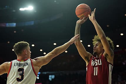 Jan 7, 2023; Tucson, Arizona, USA; Washington State Cougars forward DJ Rodman (11) shoots over Arizona Wildcats guard Pelle Larsson (3) during the first half at McKale Center. Mandatory Credit: Joe Camporeale-USA TODAY Sports