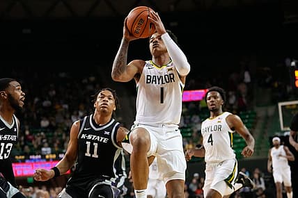Jan 7, 2023; Waco, Texas, USA; Baylor Bears guard Keyonte George (1) scores a layup past Kansas State Wildcats forward Keyontae Johnson (11) during the first half at Ferrell Center. Mandatory Credit: Chris Jones-USA TODAY Sports