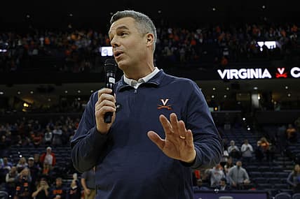 Jan 7, 2023; Charlottesville, Virginia, USA; Virginia Cavaliers head coach Tony Bennett (L) addresses the crowd after becoming the all-time winningest coach in men's basketball program history after the Cavaliers' game against the Syracuse Orange at John Paul Jones Arena. Mandatory Credit: Geoff Burke-USA TODAY Sports
