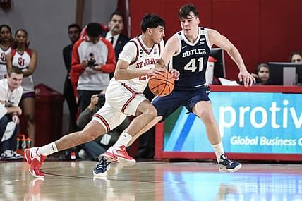 Jan 10, 2023; Queens, New York, USA;  St. John's Red Storm guard Rafael Pinzon (24) drives past Butler Bulldogs guard Simas Lukosius (41) in the first half at Carnesecca Arena. Mandatory Credit: Wendell Cruz-USA TODAY Sports