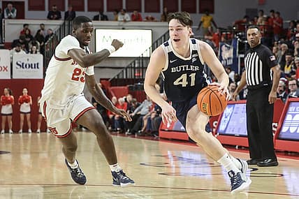 Jan 10, 2023; Queens, New York, USA;  Butler Bulldogs guard Simas Lukosius (41) looks to drive past St. John's Red Storm forward David Jones (23) in the first half at Carnesecca Arena. Mandatory Credit: Wendell Cruz-USA TODAY Sports