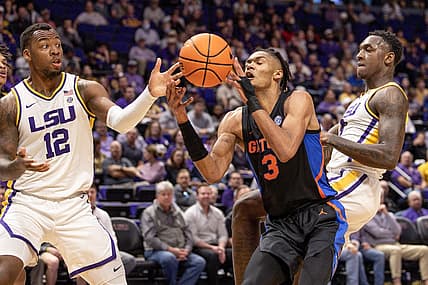 Jan 10, 2023; Baton Rouge, Louisiana, USA;  Florida Gators forward Alex Fudge (3) dribbles against LSU Tigers forward KJ Williams (12) during the first half at Pete Maravich Assembly Center. Mandatory Credit: Stephen Lew-USA TODAY Sports