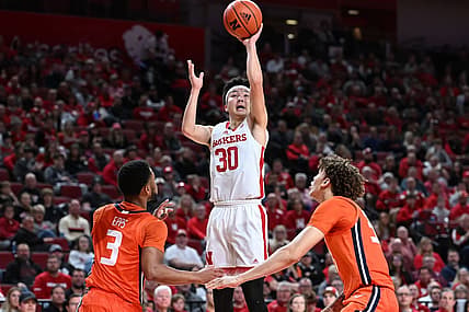 Jan 10, 2023; Lincoln, Nebraska, USA;  Nebraska Cornhuskers guard Keisei Tominaga (30) scores over Illinois Fighting Illini guard Jayden Epps (3) in the first half at Pinnacle Bank Arena. Mandatory Credit: Steven Branscombe-USA TODAY Sports