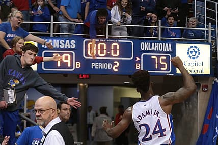 Kansas sophomore guard KJ Adams Jr. (24) pumps his arms up as he leaves Allen Fieldhouse after defeating Oklahoma 79-75 Tuesday night.