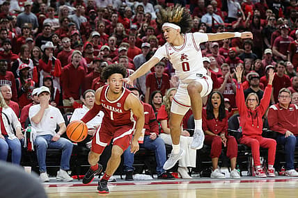 Jan 11, 2023; Fayetteville, Arkansas, USA; Alabama Crimson Tide guard Mark Sears (1) controls the ball as Arkansas Razorbacks guard Anthony Black (0) defends during the first half at Bud Walton Arena. Mandatory Credit: Nelson Chenault-USA TODAY Sports