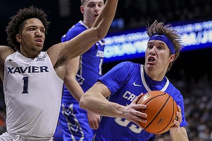 Jan 11, 2023; Cincinnati, Ohio, USA; Creighton Bluejays guard Baylor Scheierman (55) drives to the basket against Xavier Musketeers guard Desmond Claude (1) in the first half at Cintas Center. Mandatory Credit: Katie Stratman-USA TODAY Sports