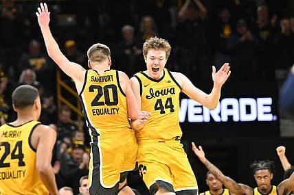 Jan 12, 2023; Iowa City, Iowa, USA; Iowa Hawkeyes forward Riley Mulvey (44) and forward Payton Sandfort (20) react after the game against the Michigan Wolverines at Carver-Hawkeye Arena. Mandatory Credit: Jeffrey Becker-USA TODAY Sports