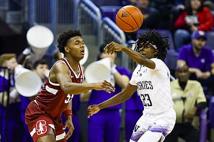 Jan 12, 2023; Seattle, Washington, USA; Washington Huskies guard Keyon Menifield (23) steals a pass from Stanford Cardinal forward Harrison Ingram (55) during the first half at Alaska Airlines Arena at Hec Edmundson Pavilion. Mandatory Credit: Joe Nicholson-USA TODAY Sports