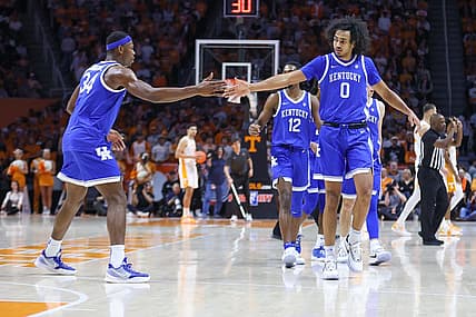Jan 14, 2023; Knoxville, Tennessee, USA; Kentucky Wildcats forward Oscar Tshiebwe (34) and forward Jacob Toppin (0) react after a play against the Tennessee Volunteers during the first half at Thompson-Boling Arena. Mandatory Credit: Randy Sartin-USA TODAY Sports