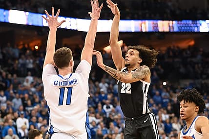 Jan 14, 2023; Omaha, Nebraska, USA;  Providence Friars guard Devin Carter (22) scores over Creighton Bluejays center Ryan Kalkbrenner (11) in the first half at CHI Health Center Omaha. Mandatory Credit: Steven Branscombe-USA TODAY Sports