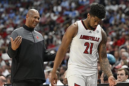 Jan 14, 2023; Louisville, Kentucky, USA;  Louisville Cardinals forward Sydney Curry (21) receives instruction from head coach Kenny Payne as he heads to the bench during the second half against the North Carolina Tar Heels at KFC Yum! Center. North Carolina defeated Louisville 80-59. Mandatory Credit: Jamie Rhodes-USA TODAY Sports