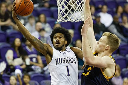 Jan 14, 2023; Seattle, Washington, USA; Washington Huskies forward Keion Brooks (1) rises for a layup attempt against California Golden Bears forward Lars Thiemann (21) during the first half at Alaska Airlines Arena at Hec Edmundson Pavilion. Mandatory Credit: Joe Nicholson-USA TODAY Sports