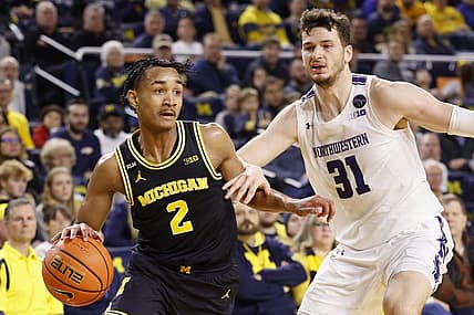 Jan 15, 2023; Ann Arbor, Michigan, USA;  Michigan Wolverines guard Kobe Bufkin (2) dribbles past Northwestern Wildcats forward Robbie Beran (31) in the first half at Crisler Center. Mandatory Credit: Rick Osentoski-USA TODAY Sports