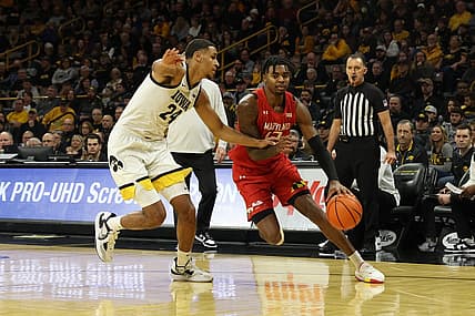 Jan 15, 2023; Iowa City, Iowa, USA; Iowa Hawkeyes forward Kris Murray (24) defends Maryland Terrapins forward Pavlo Dziuba (12) at Carver-Hawkeye Arena. Mandatory Credit: Reese Strickland-USA TODAY Sports