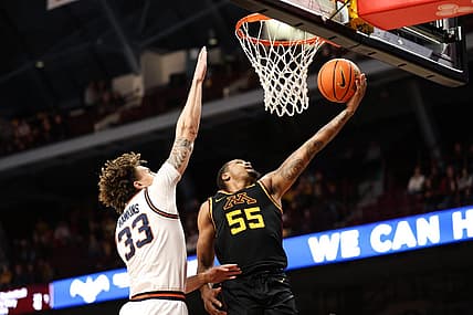 Jan 16, 2023; Minneapolis, Minnesota, USA; Minnesota Golden Gophers guard Ta'lon Cooper (55) shoots while Illinois Fighting Illini forward Coleman Hawkins (33) defends during the first half at Williams Arena. Mandatory Credit: Matt Krohn-USA TODAY Sports
