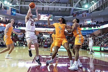 Jan 16, 2023; Charleston, South Carolina, USA; Charleston Cougars forward Ben Burnham (25) shoots the ball in the second half over William & Mary Tribe forward Noah Collier (5) at TD Arena. Mandatory Credit: David Yeazell-USA TODAY Sports