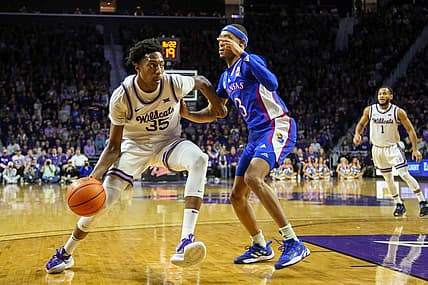 Jan 17, 2023; Manhattan, Kansas, USA; Kansas State Wildcats forward Nae'Qwan Tomlin (35) dribbles against Kansas Jayhawks guard DaJuan Harris Jr. (3) during the first half at Bramlage Coliseum. Mandatory Credit: Scott Sewell-USA TODAY Sports