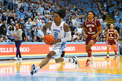 Jan 17, 2023; Chapel Hill, North Carolina, USA; North Carolina Tar Heels guard Caleb Love (2) on a break away as Boston College Eagles guard DeMarr Langford Jr. (5) defends in the second half at Dean E. Smith Center. Mandatory Credit: Bob Donnan-USA TODAY Sports
