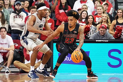 Jan 17, 2023; Madison, Wisconsin, USA; Wisconsin Badgers guard Chucky Hepburn (23) dribbles the ball under coverage by Penn State Nittany Lions guard Jalen Pickett (22)  during the first half at the Kohl Center. Mandatory Credit: Kayla Wolf-USA TODAY Sports