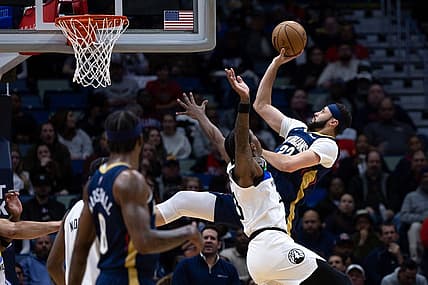 Jan 25, 2023; New Orleans, Louisiana, USA;  New Orleans Pelicans forward Larry Nance Jr. (22) shoots a jump shot against Minnesota Timberwolves forward Jaden McDaniels (3) during the first half at Smoothie King Center. Mandatory Credit: Stephen Lew-USA TODAY Sports