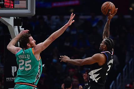 Jan 26, 2023; Los Angeles, California, USA; Los Angeles Clippers forward Kawhi Leonard (2) shoots against San Antonio Spurs center Jakob Poeltl (25) during the first half at Crypto.com Arena. Mandatory Credit: Gary A. Vasquez-USA TODAY Sports