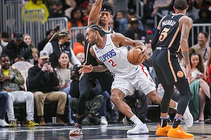 Jan 28, 2023; Atlanta, Georgia, USA; LA Clippers forward Kawhi Leonard (2) is defended by Atlanta Hawks forward De'Andre Hunter (12) in the first quarter at State Farm Arena. Mandatory Credit: Brett Davis-USA TODAY Sports