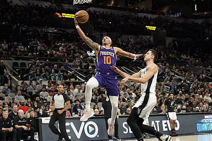 Jan 28, 2023; San Antonio, Texas, USA; Phoenix Suns guard Damion Lee (10) lays in a basket while defended by San Antonio Spurs forward Zach Collins (23) during the first half at AT&T Center. Mandatory Credit: Scott Wachter-USA TODAY Sports