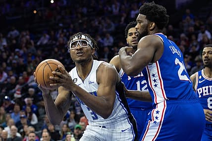 Jan 30, 2023; Philadelphia, Pennsylvania, USA; Orlando Magic center Wendell Carter Jr. (34) controls the ball in front of Philadelphia 76ers center Joel Embiid (21) during the first quarter at Wells Fargo Center. Mandatory Credit: Bill Streicher-USA TODAY Sports