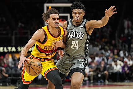 Apr 2, 2022; Atlanta, Georgia, USA; Atlanta Hawks guard Trae Young (11) is guarded by Brooklyn Nets guard Cam Thomas (24) during the second half at State Farm Arena. Mandatory Credit: Dale Zanine-USA TODAY Sports