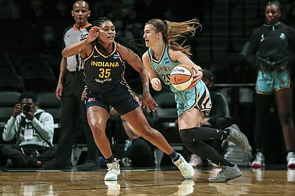 Jun 1, 2022; Brooklyn, New York, USA; New York Liberty guard Sabrina Ionescu (20) drives past Indiana Fever guard Victoria Vivians (35) in the first quarter at Barclays Center. Mandatory Credit: Wendell Cruz-USA TODAY Sports