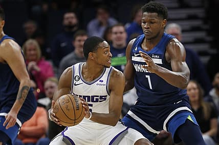 Jan 30, 2023; Minneapolis, Minnesota, USA; Sacramento Kings guard De'Aaron Fox (5) tries to work around Minnesota Timberwolves forward Anthony Edwards (1) in the fourth quarter at Target Center. Mandatory Credit: Bruce Kluckhohn-USA TODAY Sports