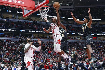 Feb 2, 2023; Chicago, Illinois, USA; Chicago Bulls guard Ayo Dosunmu (12) goes to the basket against the Charlotte Hornets during the first half at United Center. Mandatory Credit: Kamil Krzaczynski-USA TODAY Sports
