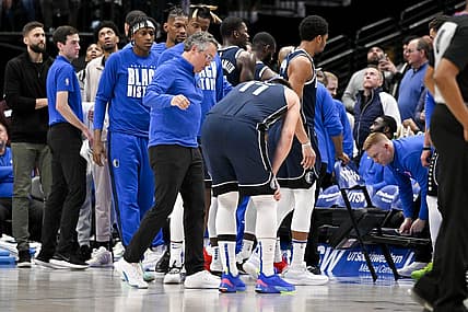 Feb 2, 2023; Dallas, Texas, USA; Dallas Mavericks guard Luka Doncic (77) is checked by a team trainer after he is fouled by New Orleans Pelicans forward Brandon Ingram (not pictured) as he drives to the basket during the second half at the American Airlines Center. Mandatory Credit: Jerome Miron-USA TODAY Sports