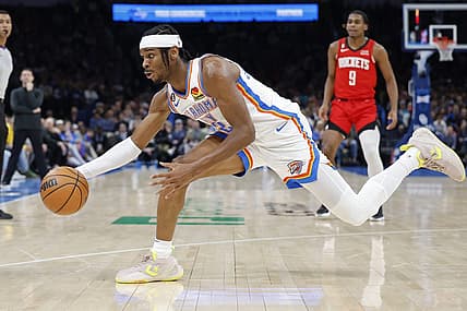 Feb 4, 2023; Oklahoma City, Oklahoma, USA; Oklahoma City Thunder guard Shai Gilgeous-Alexander (2) reaches for a loose ball during the first quarter against the Houston Rockets at Paycom Center. Mandatory Credit: Alonzo Adams-USA TODAY Sports